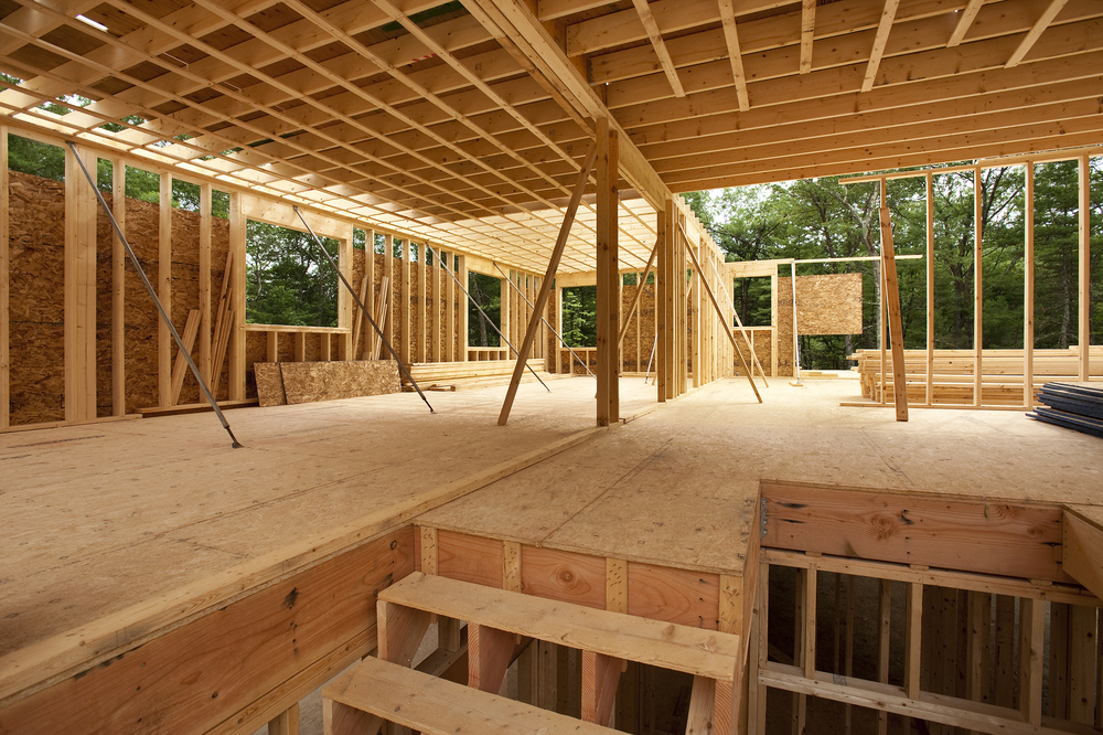 Timber frame construction in progress on a new build home in Dorking, showing early layout and structural design stages